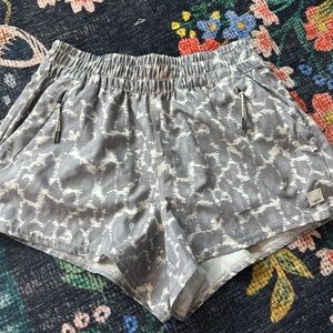 Vuori Women's Athletic Shorts in Gray and White